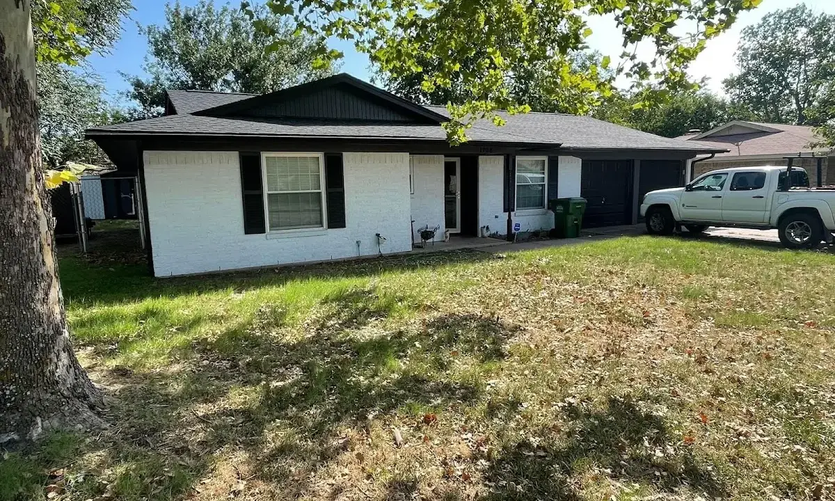 Professional roofing crew working on a residential roof in Osage Beach